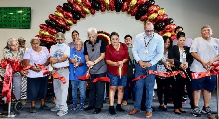 Tachi officials and others hold a ribbon-cutting ceremony.